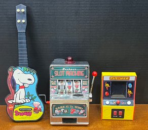 1970 Mattel Snoopy Music Maker, Bandai Pac-man Hand Held Arcade Game, And Jackpot Slot Machine