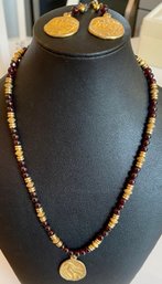 Gold Tone And Garnet Medallion Necklace With Matching Earrings