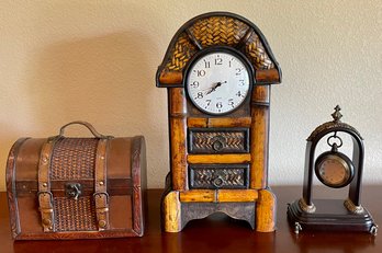 Bombay Company Hanging Watch With Case, Wicker Clock With Drawers, And A Wicker And Leather Small Trunk