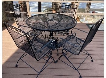 Black Wrought Iron Mesh Patio Set With 4 Rocking Chairs, 4 Seat Cushions, Table, And Umbrella Weighted Stand