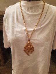 Long Dangly Gold Tone Pendant Necklace