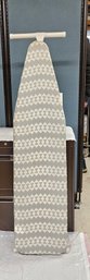 Lot 5-137  Ironing Board With Cover (behind Table)