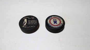 2 Vtg Hockey Pucks