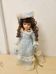 Doll In Light Blue Clothes
