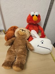 4 Stuffed Animals - 1 Build A Bear, 1 Wildlife Artist, 1 Sesame Street Elmo, 1 Kohl's Cares For Kids