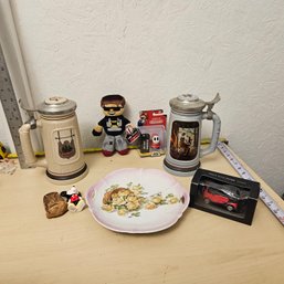 Eclectic Toy And Collectible Set: 2 Steins, Sky Stuffed Animal, Shy Guy Figure & More