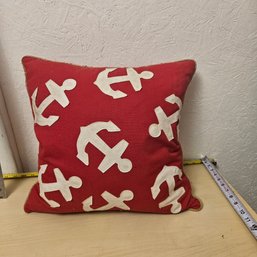 Nautical Red Pillow With White Anchor Decorations