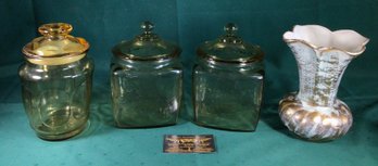 3 Lidded Glass Jars And An Elegant Gold Colored Vase