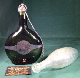 Two Glass Bottles, One Antique Balast And One Green Glass Liquor Bottle