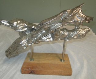 Abstract Metal Sculpture Mounted On Wooden Base