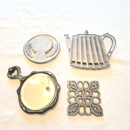 Vintage Hand Mirror And Silver Tone Trivets (Dining Room)