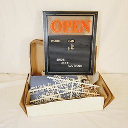 Open Sign With Letters And Velo Binder