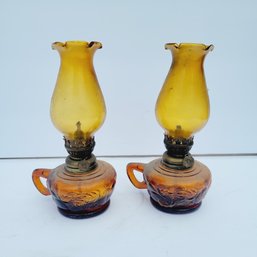 Pair Of Amber Glass Oil Lamps With Handles