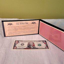 Colorized $1 Bill With History In Portfolio