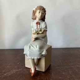 Nadal Sitting Girl With Flowers Figurine