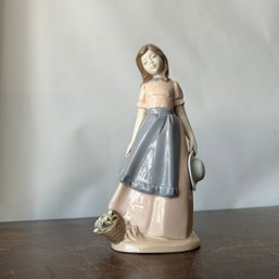 Nadal Standing Girl With Flower Basket And Hat Figurine