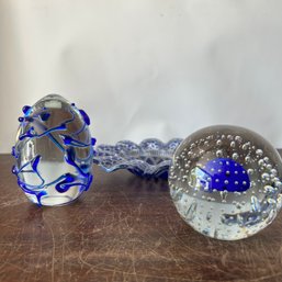 Trio Of Clear Glass & Cobalt Blue Decorative Pieces: Paperweight, Decorative Glass Egg, Ribbon Trinket Dish