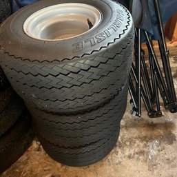 Set Of Four Small Tires (garage)