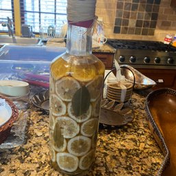 Tall Glass Bottle Of Lemons & Bay Leaves For Decor Purposes (Kitchen)