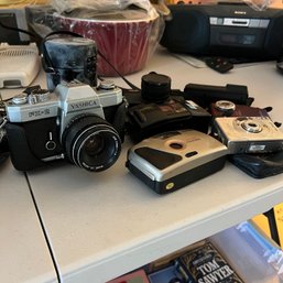 Camera Lot With Yashica FX-2 With Extra Lens And Assorted Film And Digital Cameras (LR)