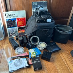 Pair Of Vintage Canon SLR Cameras, Filters, And Many Accessories In Camera Bag (Office)