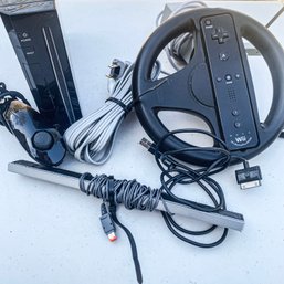 Nintendo Wii Model RVL-001 Console, Steering Wheel, Nunchuck, AC Adapter & Cords (garage)