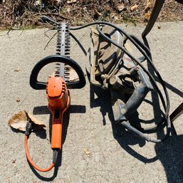 Corded Skilsaw And Hedge Trimmers (Garage Under Table)