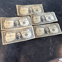 Five Circulated One-Dollar Silver Certificates (IS)