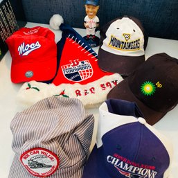 Mixed Lot Of Sports Hats, Bobblehead & Red Sox Hats (Living Room On Table Left Side)