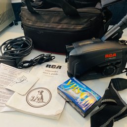 RCA Video Camcorder With Accesories & Bag (Living Room Table On Left Side)