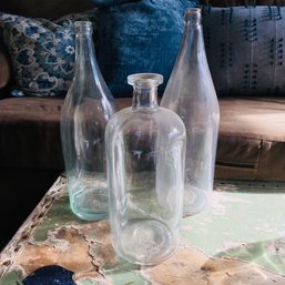 Three Large Clear Glass Wine Bottles (BT Upstairs)