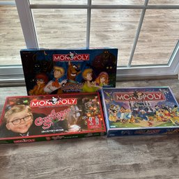 Disney Monopoly, A Christmas Story Monopoly, And Scooby Doo Monopoly (LR)