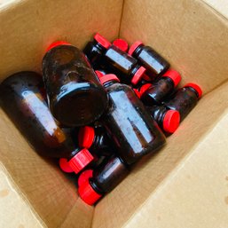 Box Of Old Brown Glass Bottles With Red Caps (garage 57193)