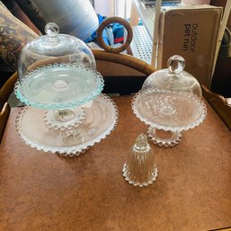 Assorted JL Glass Cake Trays With Lids And Glass Bell