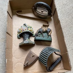 Decorative Cast Iron Lot Including Sad Irons, Horse, Bouquet, And More (Garage Right)