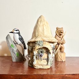 Trio Of Decorative Items: Ceramic Cottage, Wooden Carved Bear, Wooden Carved Woodpecker