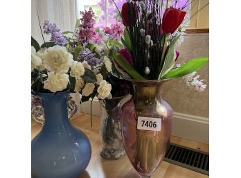 Three Vases Full Of Artificial Flowers.