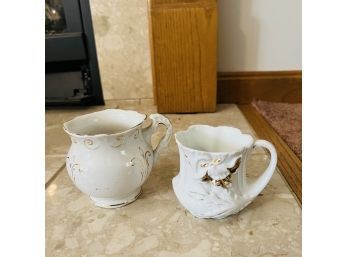 Pair Of White And Gold Handled Cups