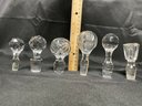 ASSORTED COLLECTION OF CRYSTAL DECANTER STOPPERS