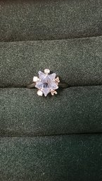 SILVER TONE RING WITH STAR SHAPED AQUAMARINE CENTER STONE