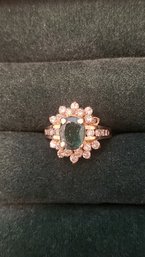 14KT GOLD EMERALD AND DIAMOND HALO RING