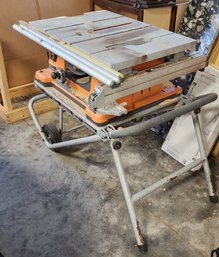 RIGID TS2400 10 INCH TABLE SAW WITH WORK N HAUL IT TWO WHEEL WORK STAND