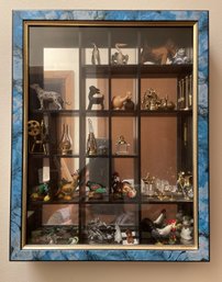 MIRRORED DISPLAY CASE WITH ASSORTED DECOR FEATURING SWAROVSKI FIGURINES AND DECOR