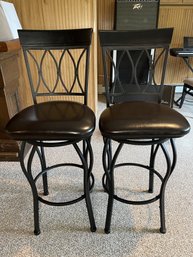 PAIR OF BLACK STEEL AND WOOD SWIVEL BAR STOOL W/ ESPRESSO PADDED FAUX LEATHER SEATS