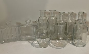 ASSORTMENT OF GLASS BOTTLES AND VASES