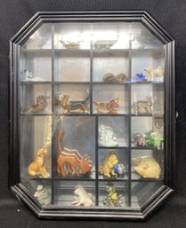 MIRRORED DISPLAY CASE WITH ASSORTED DECOR FEATURING HAND CARVED AL MYERS FIGURINE AND HAND PAINTED BANK FIGURI