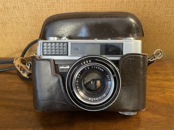 VINTAGE MINOLTA AL 35MM CAMERA WITH ROKKOR PF 45MM LENS IN ORIGINAL CARRY CASE AND MANUAL