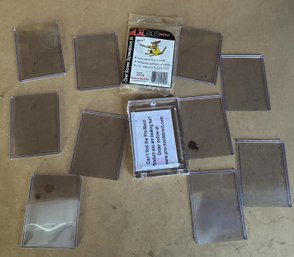 SMALL COLLECTION OF TRADING CARD PROTECTORS