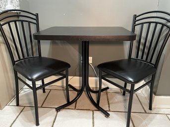 VNTAGE BLACK LAMINATED KITCHEN TABLE WITH PR OF BLACK METAL CHAIRS