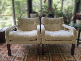 PAIR OF TUFTED UPHOLSTERED ARMCHAIRS IN THE STYLE OF MILO BAUGHMAN